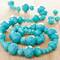 12 Packs: 4 ct. (48 total) Aqua Faceted Glass Rondelle Bead Strands by Bead Landing™